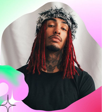 Bandfoto Feleg:
Ein Mann mit langen roten Dreadlocks und schwarzem T-Shirt blickt ernst in die Kamera. Er trägt einen flauschigen schwarz-weißen Hut und hat sichtbare Tattoos am Hals. Der Hintergrund ist schlicht weiß, eingerahmt von grafischen Farbflächen in Rosa, Grün und Türkis, die dem Bild einen modernen, künstlerischen Look verleihen.